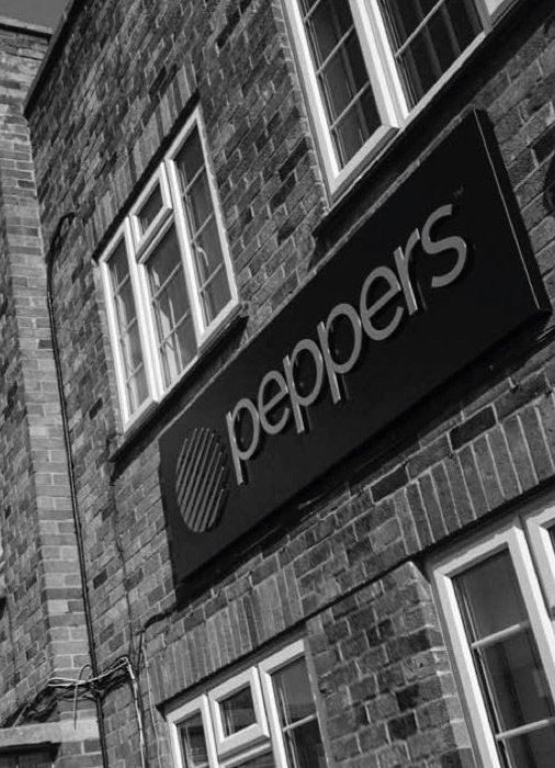 Peppers Cable Glands front of their office building with logo sign